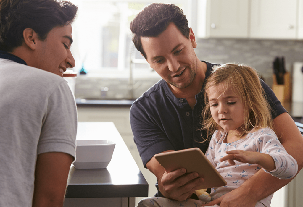 Image of father and daughter with a sales rep.